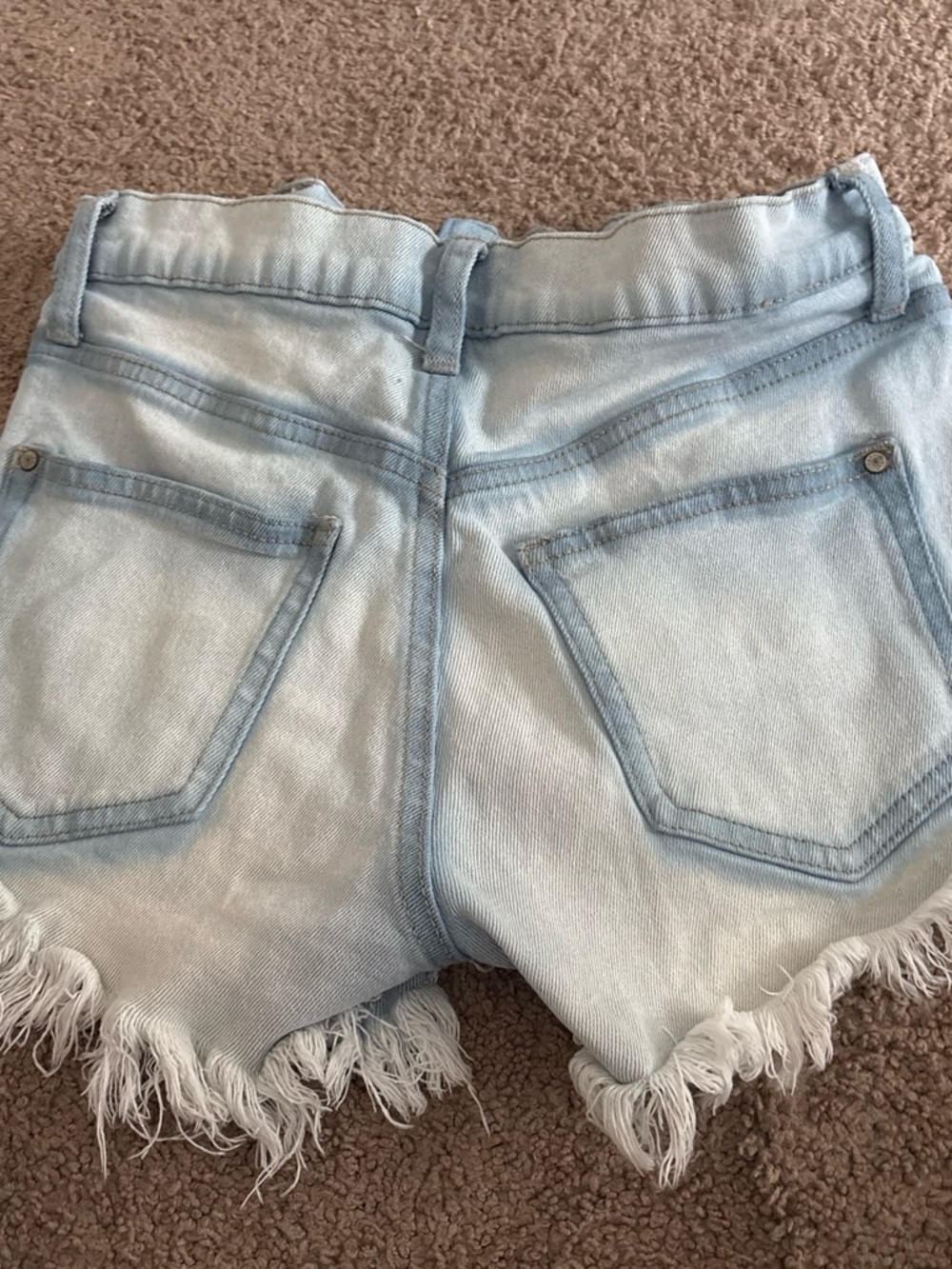 Celebrity Pink Light Wash Distressed Denim shorty Shorts